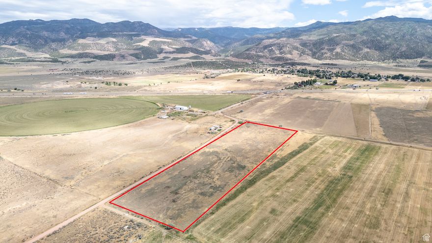 Perfect opportunity for a homestead, ranch, farmland, or investment property. The 12 acre and 3 acre parcels are being sold together, which gives you even more flexibility. 1 acre foot of water is included, with the opportunity to purchase additional shares. Power is just across the street, the land is fully fenced, and irrigation heads are already in place and can be included. Seller financing is offered with 20 percent down at a 5 percent interest rate. Please call for details. Buyer to verify all.  Includes Parcel # D-0027-0000-0000.