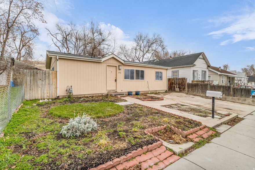 Manufactured home on a permanent foundation featuring an open floor plan with vaulted ceilings and a spacious primary suite with private bath and walk-in closet. Functional layout with comfortable living areas throughout. The backyard includes a covered patio and storage shed, along with a concrete pad offering space for additional storage or outdoor use. A solid opportunity for affordable homeownership.