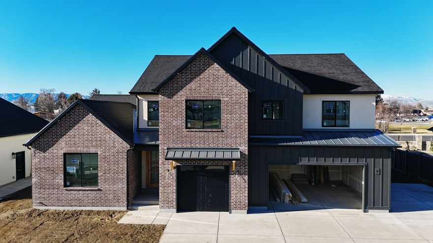 The Madison, one of our most sought-after floor plans, now available in the beautiful Autumn Crest neighborhood in American Fork, UT. Designed with space and comfort in mind, this home offers a bright, open feel perfect for modern living. The main level features a luxurious primary suite with a spa-like en-suite bath and a private office, ideal for work or relaxation. The open floor plan, high ceilings, custom finishes, and fireplace along with many built ins and arches make this feel like HOME. This is our Final phase. The Basement set up for a future ADU with Basement entrance. Upstairs, you'll find four spacious bedrooms and two full bathrooms, providing room for everyone. Scheduled for completion end of the  year. Ask about our 4.99% fixed rate for qualified buyers closed before end of the year.