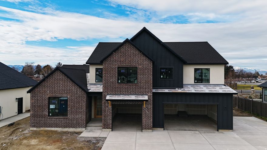 The Madison, one of our most sought-after floor plans, now available in the beautiful Autumn Crest neighborhood in American Fork, UT. Designed with space and comfort in mind, this home offers a bright, open feel perfect for modern living. The main level features a luxurious primary suite with a spa-like en-suite bath and a private office, ideal for work or relaxation. The open floor plan, high ceilings, custom finishes, and fireplace along with many built ins and arches make this feel like HOME. This is our Final phase. The Basement set up for a future ADU with Basement entrance. Upstairs, you'll find four spacious bedrooms and two full bathrooms, providing room for everyone. Scheduled for completion end of the  year. Ask about our 4.99% fixed rate for qualified buyers closed before end of the year.