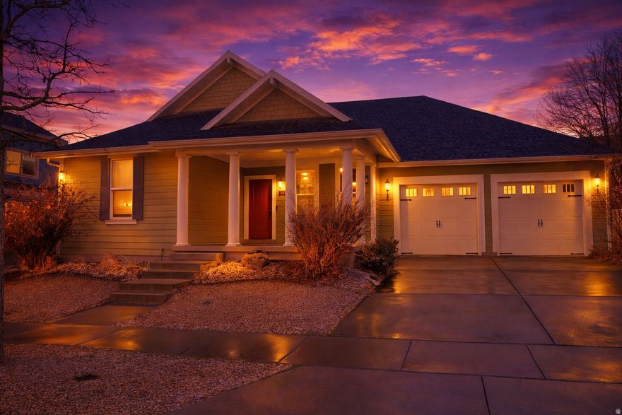 Welcome home to this spacious and beautifully designed residence in the heart of Daybreak, where comfort, lifestyle, and charm come together effortlessly.  Step inside to soaring vaulted ceilings in the great room and an open-concept floor plan that creates an airy, inviting atmosphere perfect for both everyday living and entertaining. Recessed lighting throughout the entire home enhances the bright, modern feel. The open kitchen is a true centerpiece, featuring a corner pantry, large island with stylish pendant lighting, gas range, and a newly replaced sink. Whether you're hosting gatherings or enjoying a quiet night in, this thoughtfully designed space flows seamlessly into the living area, where a warm and cozy fireplace sets the perfect tone for relaxation.  Want to make your move easier? This home includes the washer and dryer-conveniently located off the kitchen in the laundry room with included cabinets-as well as the refrigerator, so you don't even need to bring your own.  Elegant crown molding enhances the front room and bedrooms, adding timeless charm and character. The large primary suite offers a peaceful retreat with its own private en suite bathroom, complete with a spacious vanity, separate jetted tub and shower, spacious walk-in closet, and the added luxury of electric bidets for extra comfort.  Downstairs, the well-lit basement is an entertainer's dream. Enjoy a full wet bar, surround sound system, and a dedicated theater room featuring immersive surround sound, a step-up platform for stadium seating, and an included 80-inch Sony TV-ready for movie nights and game days.  Speaking of games, you can enjoy the included electronic dart board with cabinet, adding even more fun to your hosting space. With an additional full bathroom and two additional spacious bedrooms, one with a large walk-in closet, the basement checks all the boxes.   Technology and convenience shine throughout the home, including a tri-band WiFi 6E mesh system for enhanced connectivity, an August Smart Lock on the front door for keyless access, and a smart sprinkler controller that makes yard care effortless.  The impressive 3-car garage features a tandem space that is two cars deep, providing extra room for vehicles, storage, or recreational gear. It also includes a Tesla Universal Car Charging Station compatible with both J-1772 and NACS connectors-perfect for current or future EV owners.  Step outside to your own personal backyard oasis. The covered patio provides the perfect setting for outdoor dining or relaxing evenings beneath mature trees that offer both shade and beauty. A convenient door with a built-in pet entrance makes life easy for furry companions (and the original door is included if preferred).  Located directly across the street from Firmont Park-complete with a play place and expansive open field-and just a couple of blocks from the Daybreak community center and pool, this home truly sits in the center of it all. With parks, pools, and vibrant community amenities just steps away, you'll love living in one of the area's most sought-after neighborhoods.  This is more than a home-it's a lifestyle.   Square footage figures are provided as a courtesy estimate only and were obtained from County Records.  Buyer is advised to obtain an independent measurement.