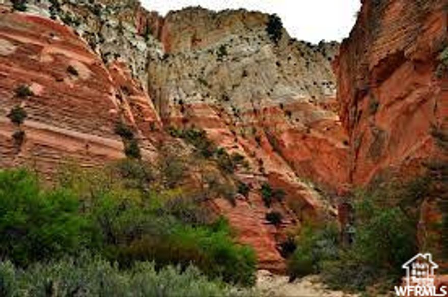 Incredible Lot! Red Valley Heights Phase 1 Lot #8 with .42 acres overlooking highway 89, and Orderville valley with magnificent white cliffs as a backdrop. Sitting at the base of Red Hollow Slot Canyon trail. Enjoy the old original Main Street US-89, rich Utah history, best temperatures in the state, small town living at its finest with utilities brought to the front of each lot. 18 acres open space behind the lot. CC&R's but no HOA, best of all worlds. Red Valley Heights is just minutes away from Zion National Park, Bryce Canyon, Kanab, and 1 hr and a half from Lake Powell. These lots are going fast! Square footage figures are provided as a courtesy estimate only and were obtained from surveyor report. Buyer is advised to obtain an independent measurement.