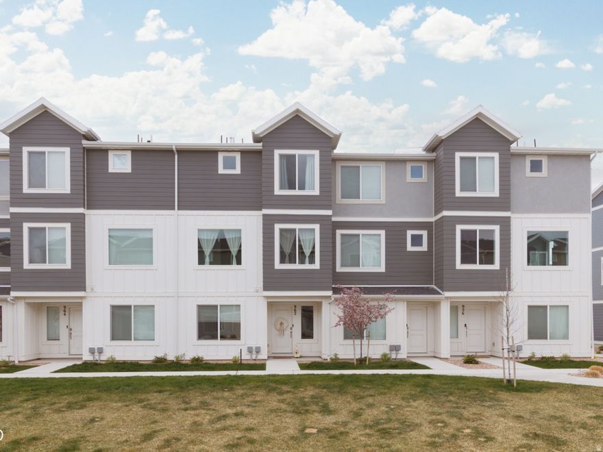 Welcome to this light and bright Saratoga Springs townhome, offering a thoughtful layout, beautiful upkeep, and a lifestyle you'll love. From the moment you step inside, you'll appreciate the open feel, natural light, and well-designed spaces that make this home both comfortable and functional. The main-level bedroom and bathroom provide incredible flexibility which is perfect for a home office, hosting guests, or even running a small home business. Upstairs, you'll find three additional bedrooms and two full bathrooms, creating the ideal setup for family living, guests, or additional workspace. This well-cared for unit also features a spacious 2-car garage and is located in a vibrant community with a pool, parks, and walking trails, offering plenty of opportunities to enjoy the outdoors and connect with neighbors. Conveniently located just minutes from shopping, dining, and great schools, and only 10 minutes from Silicon Slopes, this home offers the perfect balance of comfort, convenience, and community living. Clean, functional, and move-in ready makes this is a home you won't want to miss. Square footage figures are provided as a courtesy estimate only and were obtained from County records.  Buyer is advised to obtain an independent measurement.