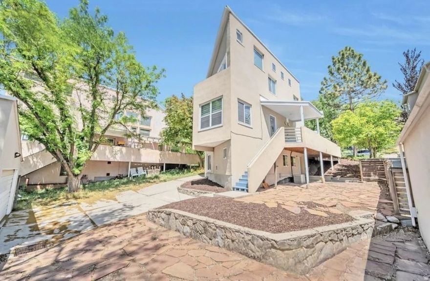 OPEN HOUSES THIS WEEKEND: APRIL 10-12th, 2026 (See Open House Schedule for details!) Nestled in the heart of Salt Lake City's coveted Capitol Hill neighborhood. This 4-bedroom, 2.5-bath residence offers the perfect balance of classic charm and modern functionality, all within minutes of downtown, City Creek Canyon, and the Utah State Capitol. Step inside to find a bright, open living space with vaulted ceilings and large windows that fill the home with natural light. The kitchen features contemporary cabinetry, Bosch stainless steel appliances, with mountain and valley views. The bedrooms are generously sized, and the primary suite includes a walk-in closet and private balcony accessed through a French door. Enjoy peaceful evenings on the private deck or entertain in the xeri-scaped backyard. Additional highlights include a two-car garage and endless hot water with the ultra efficient tankless water heater. Perfect for those seeking urban convenience in a quiet, historic neighborhood, this home is a rare find in one of Salt Lake's most desirable locations.