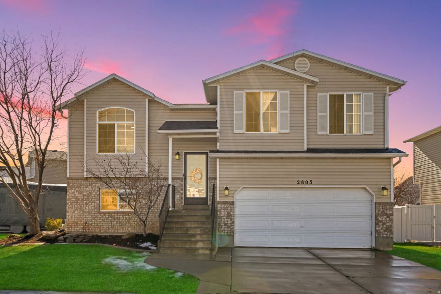 Welcome to 2803 W 2025 S, Syracuse. This charming home boasts 4 cozy bedrooms and 3 bathrooms.  You'll love the new roof (2022) and fresh paint and flooring (2024), plus a brand-new HVAC system installed in 2025.  Step outside to a spacious, fully fenced backyard with mature trees, ideal for gatherings or playtime. Plus, there's a 45' RV pad with electric hookups ready for your adventures!  The large kitchen offers plenty of counter space.  This home is nestled in a friendly neighborhood and you'll be minutes from the Costco set to open this summer. Great proximity to the West Davis Highway for a quick commute to SLC.  All information is deemed reliable but is not guaranteed.  Buyer and Buyer's Agent to verify all information provided.