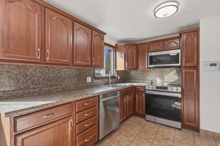 Rare, move-in-ready rambler in a convenient West Jordan location. This 4-bedroom, 2-bathroom home features a fresh interior with new paint and carpet throughout. Major high-ticket upgrades provide peace of mind: new roof (2024), new furnace (2023), new water heater (2023), new electrical panel (2023), and A/C (2021). The updated kitchen flows into a functional layout, complemented by a dedicated utility room offering plenty of storage. The exterior is built for utility, featuring a massive, extra-wide driveway approximately 65 feet long, perfect for RV parking. The detached 2-car garage includes a built-in workbench for projects. Located just steps from Jordan Landing and Bangerter Highway, you are minutes from premium shopping, dining, and entertainment. This property combines extensive mechanical updates with incredible parking and shop space in a highly accessible area. Square footage figures are provided as a courtesy estimate only and were obtained from county records. Buyer is advised to obtain an independent measurement. Owner/agent.