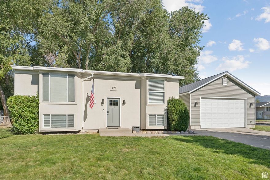 Welcome to this beautifully updated Layton home where modern updates meet everyday convenience! Ideally located close to shopping, dining, and freeway access, this home offers thoughtful upgrades inside and out.  Upstairs was fully remodeled just two years ago, including a luxurious primary suite. The bathroom features a massive shower with a soaking tub inside, euro glass surround, and a double vanity. A spacious walk-in closet completes the retreat, offering both comfort and functionality. A beautifully updated kitchen, can lighting throughout, and in-ceiling surround speakers in the family room add the perfect finishing touches to the upper level.  Walk outside and enjoy a fully fenced yard with mature trees, a powered shed, and a hot tub. Recent exterior updates include a new membrane roof (replaced within the past year) and a durable metal roof on the garage, giving peace of mind for years to come.  Car enthusiasts, hobbyists, or anyone in need of space will love the oversized detached garage (built in 2019). Measuring approximately 30' x 21', with 10'7" ceilings, a 9' garage door, built-in shelving, and a WiFi-enabled opener - this versatile space is perfect for large vehicles, toys, a workshop, or storage.  With modern updates and major improvements already complete (including a 50-gallon water heater installed in 2023), this home is truly move-in ready!   Square footage figures are provided as a courtesy estimate only and were obtained from county records.  Buyer is advised to obtain an independent measurement.