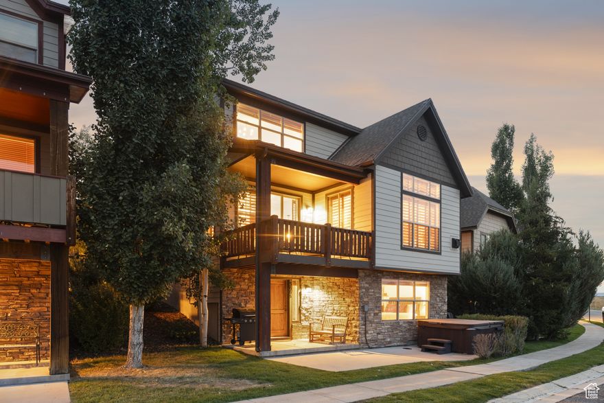 Incredible views. This stunning three-story Bear Hollow Village home harmonizes mountain contemporary design with the warmth of family living. Four spacious bedrooms, three full bathrooms, and one half bath offer comfort and privacy for every occasion. Breathtaking 360-degree vista of Swaner Nature Preserve, the majestic Uintah Mountains, and three ski resorts runs.  The kitchen is thoughtfully appointed with granite counters, an inviting island with bar seating and double ovens. Gather loved ones for laughter and shared meals in the informal dining area or step out onto the balcony and feel the gentle mountain breeze as you watch the seasons paint the landscape with color. Retreat to the serene primary suite, where a steam shower and jetted tub promise relaxation and renewal after exhilarating adventures outdoors. Throughout the house, plantation shutters and wood blinds create an ambiance of comfort and elegance. Sink into the hot tub, letting the warmth soothe you after a day of skiing or hiking, surrounded by the quiet beauty of your surroundings. This immaculate, fully furnished home has been meticulously cared for-never rented, always ready to welcome new memories. The oversized two-car garage boasts extra-high ceilings, a hose bib, and a workbench with plenty of storage. The HOA fee includes landscaping, snow removal and amenities. Enjoy the Bear Hollow clubhouse: swim in the seasonal pool, unwind in the hot tub, stay active in the fitness center, or play on the basketball and soccer courts. Miles of hiking and biking trails beckon adventure right outside your door. Whether you're seeking a peaceful primary residence, a mountain getaway, or an investment opportunity-this home welcomes you. Short-term rentals are permitted, giving you flexibility. The slopes are just minutes away, and Redstone shops and dining are a pleasant walk from your doorstep. With easy access to Interstate 80, Salt Lake International Airport is only 30 minutes away, making travel effortless.