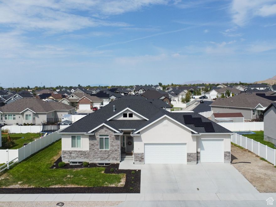 Discover the charm of Stansbury Park with this better-than-new 2021-built home that combines style, comfort, and opportunity. Its bright, open floor plan welcomes you in, featuring a spacious kitchen with two-tone cabinets, stainless steel appliances, and sleek quartz countertops. Newly installed solar panels ensure energy efficiency for years to come with only a $15/month electric bill, while the generous backyard with a play set is perfect for family fun. The unfinished basement offers endless possibilities to create extra bedrooms, a bath, and a cozy family room, allowing you to build instant equity. With VA loan assumption available and seller financing options with 25% down, this home makes ownership flexible and exciting in a thriving community.