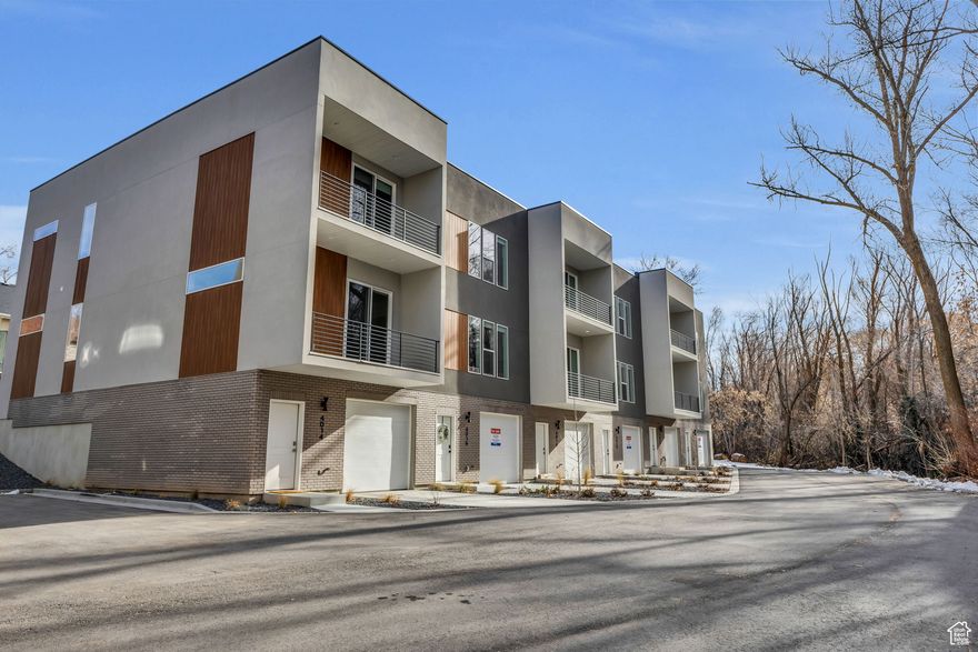 MODEL HOME HOURS TUES-FRI 12pm-4pm. Get a 2/1 buydown plus blinds and a fridge when you use our preferred lender. Choose from 3 different color schemes. Explore our brand-new, spacious THREE-story townhomes in a secluded spot in South Ogden, right by Burch Creek! These townhome's feature a huge kitchen with custom soft-close cabinets and sleek leather granite countertops. The primary suite features a large walk-in closet, tile surround shower, dual sink vanities in the bathroom and a private balcony with a gorgeous creek view. This home feels so spacious with 10ft ceilings on the first floor and 9ft on the second story. Plus, there's a huge two-car tandem garage with plenty of storage and is wired for an EV outlet. And it's super convenient, just 2 miles from Weber State University and close to Riverdale's shopping and dining hotspots. HOA will approve rental use, making these townhomes a fantastic investment opportunity!