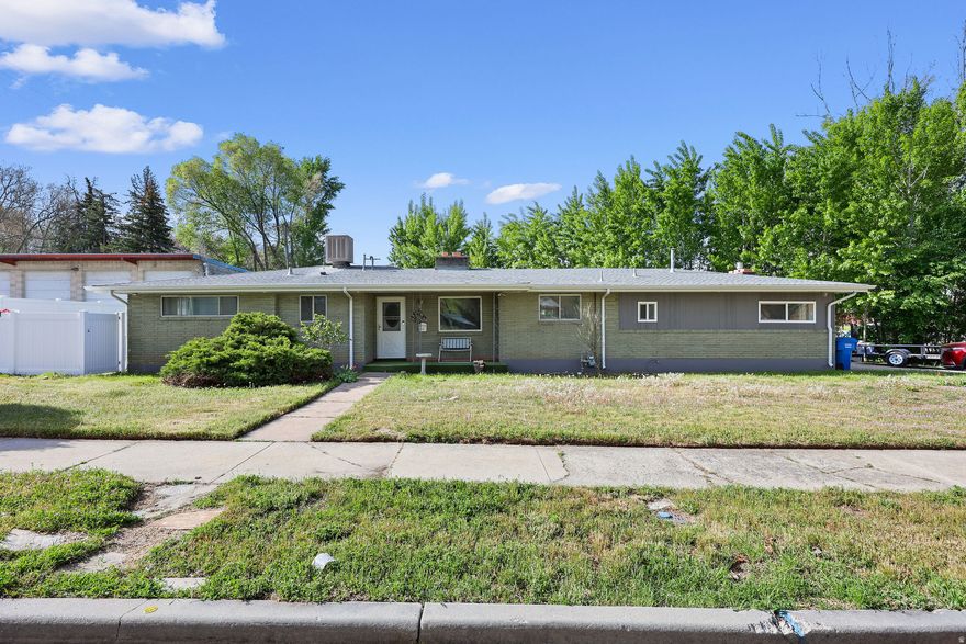 Welcome to this charming waterfront home on Box Elder Creek, offering the ease of one-level living with main-floor laundry. Freshly painted interiors and new LVP flooring create a clean, updated feel throughout. Recent improvements include a newer roof (2018), updated electrical panel (2021) with digital timers for soffit and holiday lighting, and a new water heater (2023). All appliances are included for added convenience. The living room showcases peaceful creek views and a cozy gas fireplace with brick surround, while the family room features a second gas insert fireplace for extra comfort. Downstairs, the basement provides excellent storage space plus a workshop area complete with bench, vice, and grinder. Situated on two parcels totaling .35 acre, this property offers a rare combination of waterfront setting, practical updates, and extra space to enjoy.