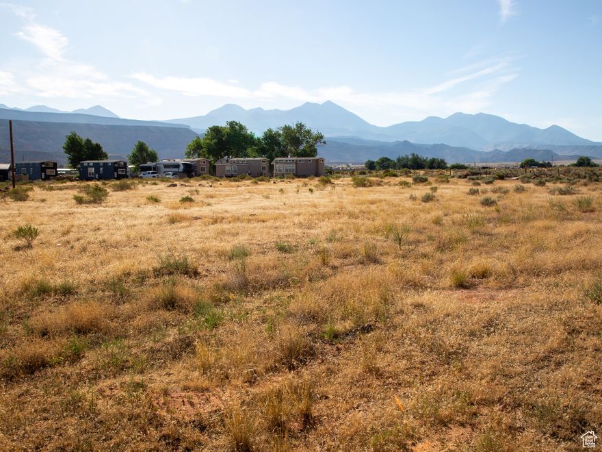 Commercial Development Opportunity  3.99 Acres in San Juan County, Just South of Moab!  Unlock the potential of this 3.99-acre parcel, offering endless commercial development opportunities. Whether you're envisioning your dream RV park, a new business venture, or expanding your current operations, this property provides a strong foundation with an existing 500 sq. ft (Office/Laundry/Restroom/Shower Building), and employee housing hookups already in place.  Located just south of Moab in San Juan County, this versatile property is perfectly positioned for growth. With ample space and flexible potential, the possibilities are wide open-RV park, lodging, service-based business, or recreation-focused enterprise-you decide.  Now is the time to bring your vision to life in one of Utah's most popular and scenic destinations!