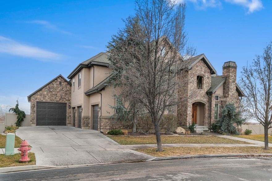 New Year, New Home! This exceptional home offers space, functionality, and stunning valley views. Featuring 6 bedrooms, 5 bathrooms, two family rooms, an office/den, formal dining room, flex area, and a 4-car garage plus a fully finished workshop, there is room for everyone and everything. The open-concept floor plan provides flexibility for daily living and entertaining. The spacious primary suite includes a luxurious ensuite with dual tub and shower, a large walk-in closet, and picturesque valley views. Expansive windows throughout fill the home with natural light while highlighting the surrounding scenery. Buyers will appreciate the abundant garage and workshop space, perfect for storage, hobbies, or projects. Square footage figures are provided as a courtesy estimate only and were obtained from Utah County Records. Buyer is advised to obtain an independent measurement.