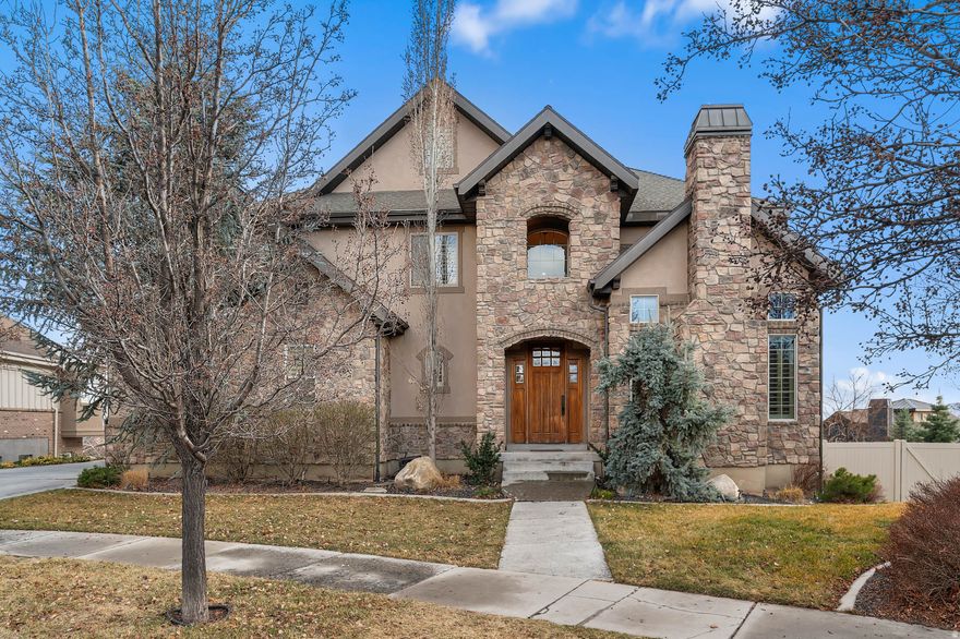 New Year, New Home! This exceptional home offers space, functionality, and stunning valley views. Featuring 6 bedrooms, 5 bathrooms, two family rooms, an office/den, formal dining room, flex area, and a 4-car garage plus a fully finished workshop, there is room for everyone and everything. The open-concept floor plan provides flexibility for daily living and entertaining. The spacious primary suite includes a luxurious ensuite with dual tub and shower, a large walk-in closet, and picturesque valley views. Expansive windows throughout fill the home with natural light while highlighting the surrounding scenery. Buyers will appreciate the abundant garage and workshop space, perfect for storage, hobbies, or projects. Square footage figures are provided as a courtesy estimate only and were obtained from Utah County Records. Buyer is advised to obtain an independent measurement.