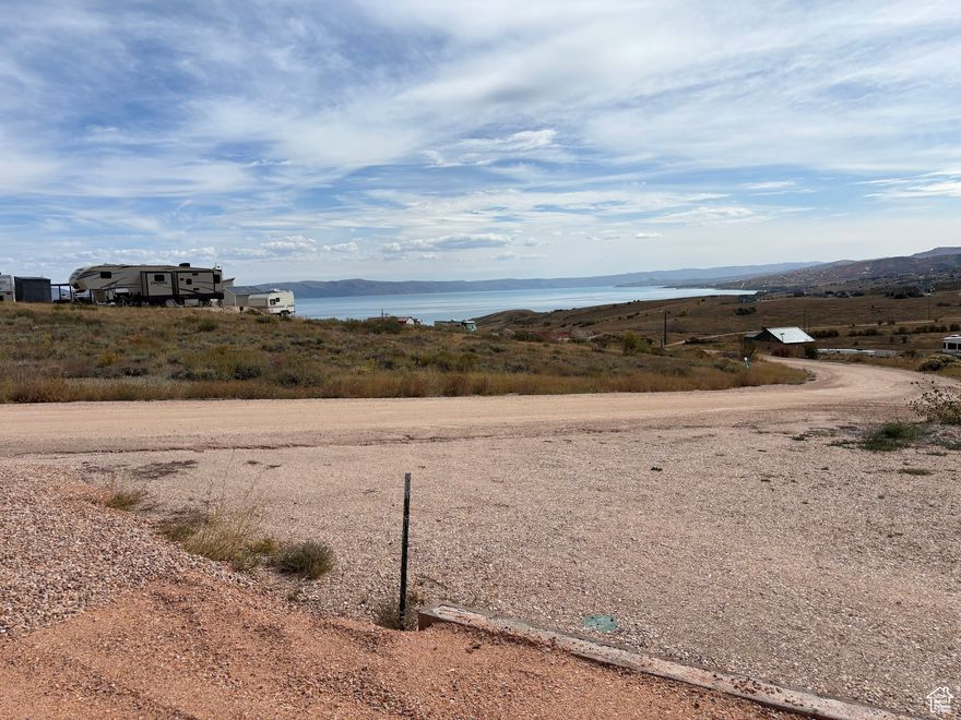 End of season deal!! Improved RV lot with beautiful Bear Lake and mountain views! Water and power already installed on the property, and lot was just leveled, fully graveled, with a retaining wall in place. Ready to be enjoyed now! Sewer dump station located front of the park. Nearly the same price as other unimproved lots without views! 40 foot 2019 Pioneer 5th wheel available for extra. Ask listing agent for more details. Jump on it today!