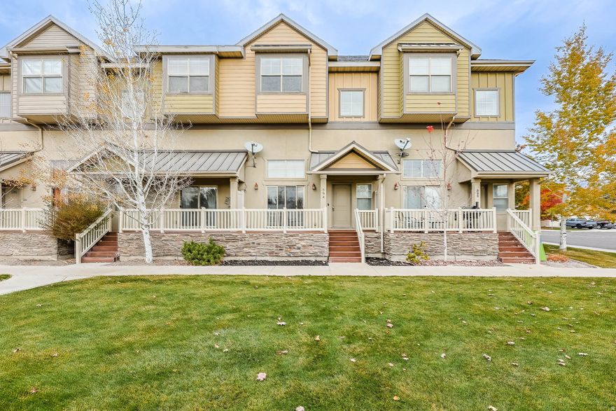 Discover a rare gem in the highly sought-after Spring Creek Ranch lakeside community in Lehi. This beautifully designed townhome offers bright, open living spaces and a warm, inviting atmosphere throughout. The main level is perfect for entertaining or relaxing, featuring a spacious living area with soaring ceilings and direct access to a charming front deck overlooking the shared green space, picnic area, and playground. Upstairs, the stylish kitchen boasts generous cabinetry, granite countertops, and an adjoining dining area. A versatile den or home office, convenient half bath, and an additional balcony complete this level, offering both functionality and comfort. The top floor features two spacious bedrooms, each with its own full bathroom, along with a conveniently located laundry room. The attached two-car garage provides security for your vehicles and easy access to additional storage space beneath the home. The Spring Creek Ranch HOA truly stands out, offering three beautiful parks, a private pickleball court, and a network of scenic trails that wind through protected wetlands-perfect for those moments when you just want to step outside and connect with nature. And that's only the beginning! Enjoy peace and privacy in this quiet community while remaining close to everything - excellent schools, shopping, dining, and quick access to I-15. This townhome perfectly blends comfort, style, and convenience in one exceptional package.