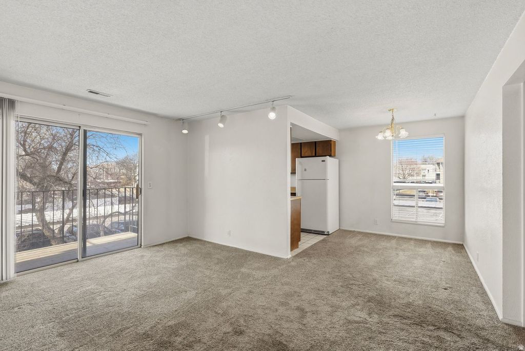 Photo of 4651 S QUAIL VISTA LN #C, Salt Lake City, UT 84117 (MLS # 2136184)