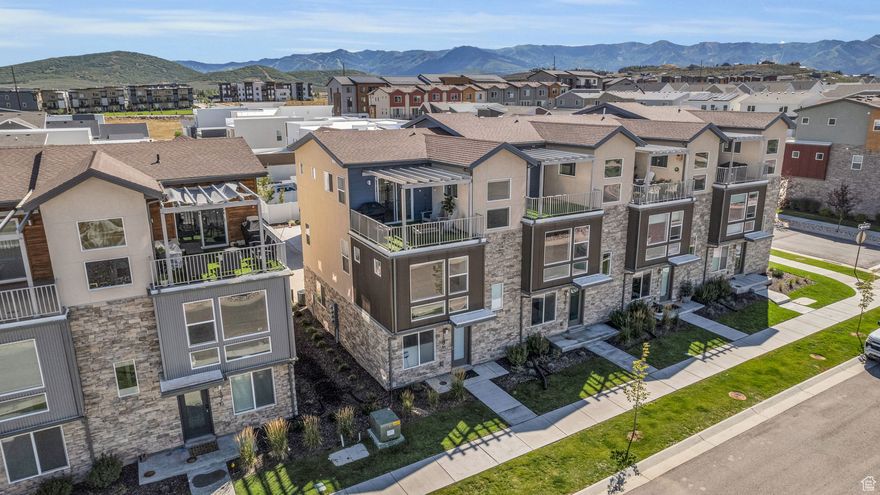 Beautifully maintained end unit townhome nestled in the heart of Silver Creek Village, one of Park City's newest and upcoming communities. This inviting residence offers the perfect combination of comfort, style, and convenience, ideal for anyone looking to enjoy a relaxed lifestyle. As you step inside you'll enjoy the flexibility of a lower level 4th bedroom or office and easy access to the attached two car garage.On the main level you'll be greeted by a bright and airy living space with an open floor plan that connects the living room, dining area, and kitchen. The kitchen features modern appliances, ample cabinetry, and a convenient breakfast bar, making it a chef's delight. The spacious primary bedroom features an en-suite bathroom with a large walk in euro glass enclosed shower. The upstairs level features two additional well-appointed bedrooms that provide plenty of space for family members, guests, or another home office location. Enjoy the views from outside from your top floor deck, perfect for outdoor gatherings, barbecues or simply unwinding after a long day. High efficiency HVAC and a tankless water heater are among some of the home's environmental certifications and energy star ratings, giving the new homeowner peace of mind and savings in their pockets. Silver Creek Village is a 310 Acre master planned community, within 40 minutes of the Salt Lake International Airport and 15 minutes away from Park City's world class ski resorts. The community features ample green space, parks and a splash pad to cool down during the summer. Future community plans include soccer/ lacrosse fields, pickleball courts, community gardens, as well as mainstreet area with commercial and mixed use retail, neighborhood markets, restaurants, and more. Located just minutes from local shops, dining, parks and trail systems, this townhome offers the perfect combination of tranquility and accessibility. Don't miss the chance to make this charming home your own!