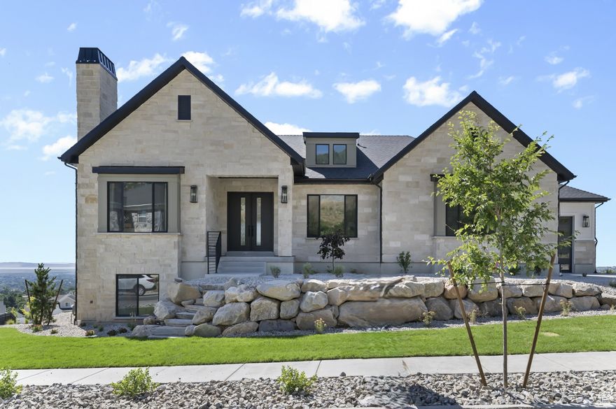 Exquisite Oakmont Traditional home with luxury finishes and thoughtful Upgrades! This stunning home showcases a chef's kitchen with custom cabinets featuring LED lighting, quartz countertops with a full-height backsplash and overhead pendant lighting, and stainless steel gas appliances for all your culinary needs. Elegant hardwood, tile, and carpet flooring flow throughout, complemented by crown molding in the office and decorative ceiling beams in the owner's bedroom. The home features an expanded 3-car garage, 10-foot basement walls with a walk-up, and finished basement space for ultimate functionality. The luxurious owner's suite boasts a free-standing tub, tile surrounds, and dual gas log fireplaces in the family room and owner's bedroom. Designed for modern comfort, the home includes a tankless water heater, power humidifier, water softener, ceiling fans in the bedrooms and family room, USB outlets, and energy-efficient options. Enjoy multi-level decks with panoramic views and Christmas light package, making this home perfect for year-round living all in a great community with stunning views! You do not want to miss out on this beautiful home!