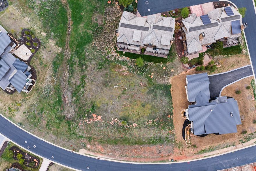 Discover an exceptional opportunity to build your dream mountain home on this beautiful 0.52-acre homesite in the prestigious gated community of Red Ledges in Heber City, Utah. This highly desirable lot offers stunning Mount Timpanogos views and is perfectly positioned within the community with easy access to entrance gates and proximity to the Village Center. Best of all, it is non-deed restricted, giving you maximum flexibility for your custom build. There are approved building plans and ARC clearance are already in place, allowing for a streamlined construction process so you can break ground sooner and begin enjoying Red Ledges living. A full golf membership is available with deposit, providing access to Red Ledges' world-class amenities, including the award-winning Jack Nicklaus Signature Golf Course and the innovative 12-hole Jack Nicklaus Signature Golf Park. Deer Valley ski shuttle and dining privileges, year round pools and sauna, golf simulators, clubhouse with restaurant. Enjoy year-round recreation with tennis, pickleball, wellness facilities, equestrian experiences, hiking, biking, and the vibrant social calendar that makes Red Ledges one of Utah's most sought-after private communities. Surrounded by breathtaking Wasatch Mountain views and resort-style living just minutes from Park City and Deer Valley, this lot is the perfect canvas for your luxury mountain retreat.