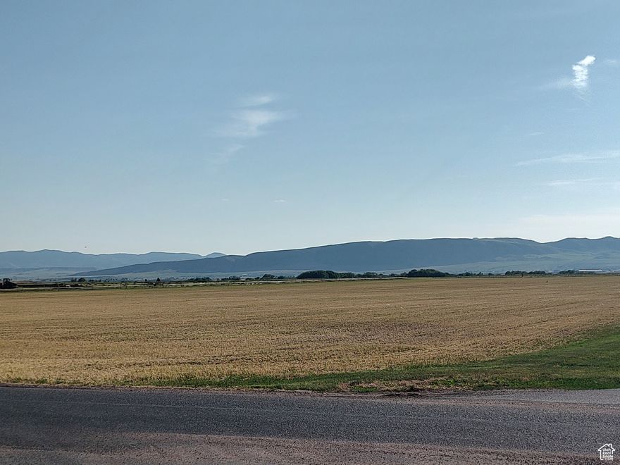 Desirable Location!  Beautiful mountain and valley views. 15.5 acres of country living within minutes to Preston, shopping and schools. Fertile soil and secondary water make this the  perfect spot for your hobby farm and custom home.  Utilities close by with city water available. Ground is currently in alfalfa. 15 water shares included.