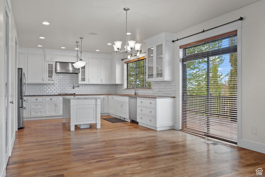 Price Drop! Stunning Lehi Home with Mountain Views & Resort-Style Living Fall in love with this gorgeous two-story home in one of Lehi's most desirable master-planned communities. The open-concept kitchen features sleek white cabinets, granite counters, and gas cooktop, flowing onto an expansive deck with breathtaking mountain views. The luxurious master suite feels like a spa retreat with dual vanities, soaking tub, and walk-in closet, while every bedroom includes its own private bathroom and walk-in closet. The finished walkout basement adds incredible flexibility with two additional bedrooms, living area, full bathroom, and kitchenette, perfect for guests, multi-generational living, or home office space. Located minutes from excellent schools, shopping, and freeway access, you'll enjoy resort-style community amenities including a pool with swim lessons, clubhouse with fitness center, multiple parks, sports courts, miles of walking trails, and professional maintenance. This home offers exceptional value with room to personalize while delivering the perfect blend of peaceful neighborhood living and urban convenience. Schedule your private tour today! Square footage from county records. Buyer should verify independently.