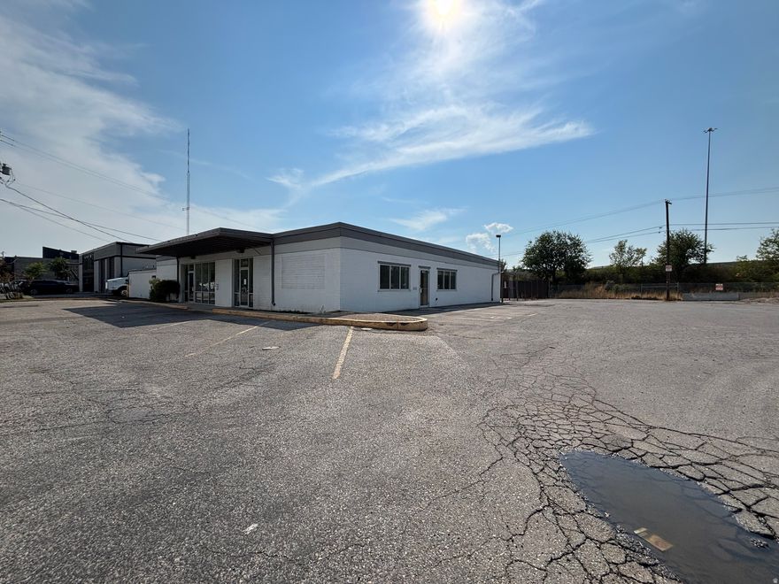 Price reduced!  And, Lease Option available.  The main building is 6000 SF with 2 garages totaling 1650 sf. Zoning permits many different uses. Potential for high density apartments.   Space has 1 GL door, apartment, retail space and garage storage. 3 phase power, freeway visible, ample parking.  SELLER FINANCING AVAILABLE.