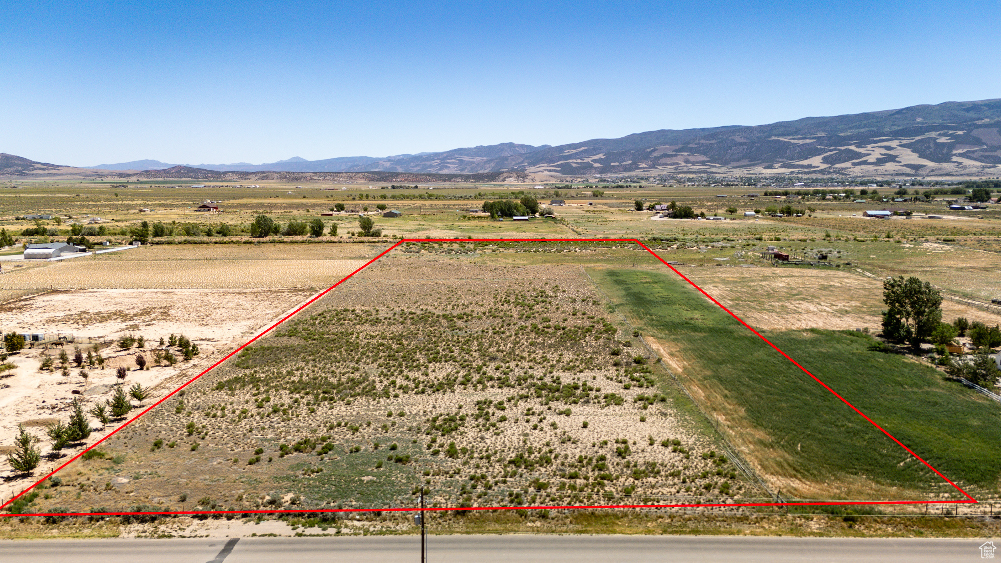 Don't miss this rare opportunity to own this 12.47 acre R-5 zoned building lot with sweeping 360 degree mountain views and plenty of room to grow! All utilities including water, sewer, gas, and electric are available in the street. 1 acre foot of water has already been transferred to the Central Iron County Water Conservation District. If you choose to drill a well then 9/10 of the water can be transferred back from the conservancy district. Up to 11 acre feet of additional writes can be purchased separately. Partially fenced and Ideal for building, grazing livestock, future development or other agricultural pursuits.
