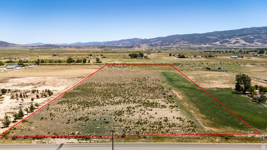 Don't miss this rare opportunity to own this 12.47 acre R-5 zoned building lot with sweeping 360 degree mountain views and plenty of room to grow! All utilities including water, sewer, gas, and electric are available in the street. 1 acre foot of water has already been transferred to the Central Iron County Water Conservation District. If you choose to drill a well then 9/10 of the water can be transferred back from the conservancy district. Up to 11 acre feet of additional writes can be purchased separately. Partially fenced and Ideal for building, grazing livestock, future development or other agricultural pursuits.