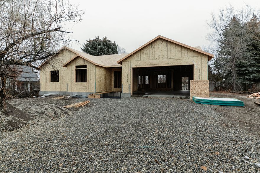 Estimated completion is March 5th, 2026. This new home by Cedar Ridge Homes is currently under construction and will feature three bedrooms and two full bathrooms. The floor plan is open and functional, with an extra-deep garage that provides plenty of room for storage or larger vehicles. There's still time for buyers to choose finishes and make selections to personalize the home and make it their own.