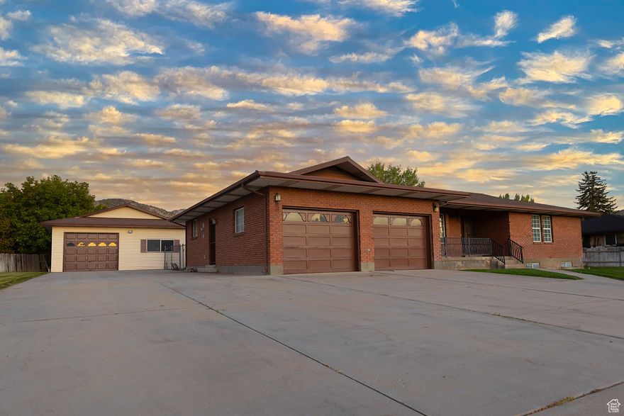 This home offers the kind of space and freedom that's hard to find. Featuring a large lot, two outbuildings, attached two-car garage and a new roof installed earlier this year. The wide lot provides room to grow, garden, or simply enjoy the open space. Whether you envision a workshop, a play yard, or a quiet retreat, its all possible here! Don't miss the second point of access off 300 South. This property is ready to adapt to your specific needs. Buyer to verify all. Call today for a private showing!