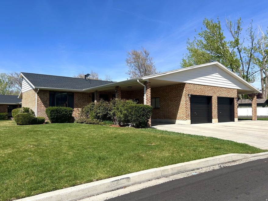 This corner lot twin home has a gorgeous mountain view, and is surrounded by a huge, rolling-hilled backyard. The neighborhood is shielded from city lighting, creating a rare dark spot where the stars can be seen on clear nights. The private drive has been recently repaved, and the fencing updated. Lawns, trees, and bushes are maintained by the HOA, which also recently provided all home exteriors with brand-new roofing, siding, and repainting. The home includes four personal parking spots, and culinary water. The kitchen is fully renovated, and the home has been thoughtfully updated throughout. Modern light fixtures and original hardwood feature in this open floor plan. Just minutes from shopping and dining, the Provo River, and many trails and parks up the canyon. The home is centered between Cascade Park, Palisade Drive, and several top schools. It's a ten-minute drive to both BYU, and UVU. This peaceful neighborhood also avoids both fault lines and sits well above flood plains.