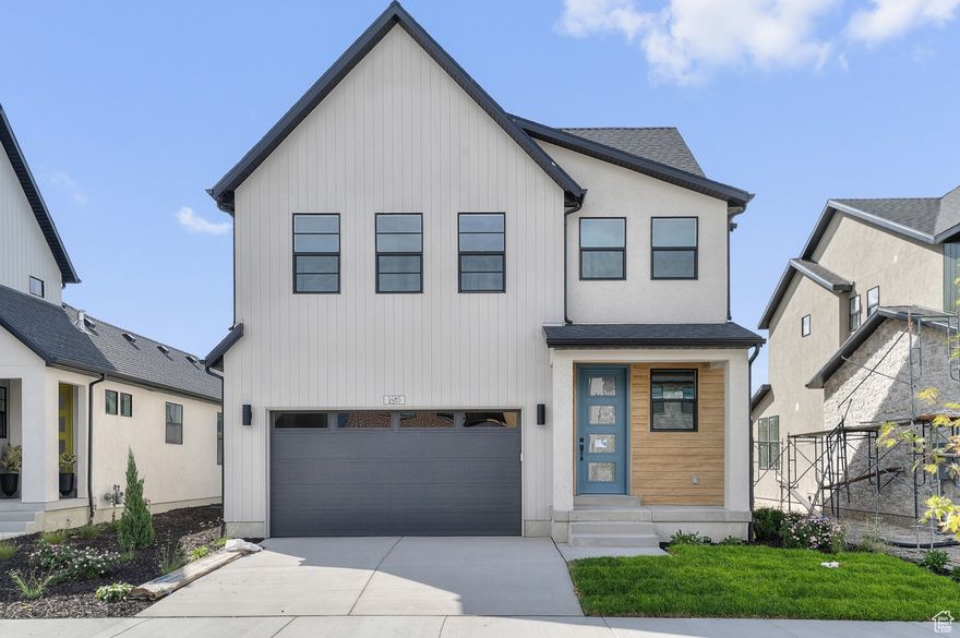 Come see this thoughtfully designed Kronborg home that showcases modern finishes and classic style. The kitchen features White Laminate cabinets, elegant quartz countertops, and stainless steel gas appliances, creating a bright and functional space perfect for cooking and entertaining. The home offers a blend of laminate hardwood, tile, and carpet flooring, complemented by can lighting throughout for a warm, welcoming atmosphere. Additional upgrades include Christmas light outlets, a tankless water heater, and energy-efficient features that enhance everyday comfort and savings. A metal railing at the stairway adds a modern touch, while Craftsman base and casing highlight timeless architectural details. The owner's bathroom provides a relaxing retreat with quartz shower surrounds and black matte hardware, combining durability with refined style. Comes fully landscaped for a turn key experience!  Finished with 2 tone paint and cohesive design elements throughout, the Krongborg offers the perfect blend of comfort, efficiency, and sophistication.