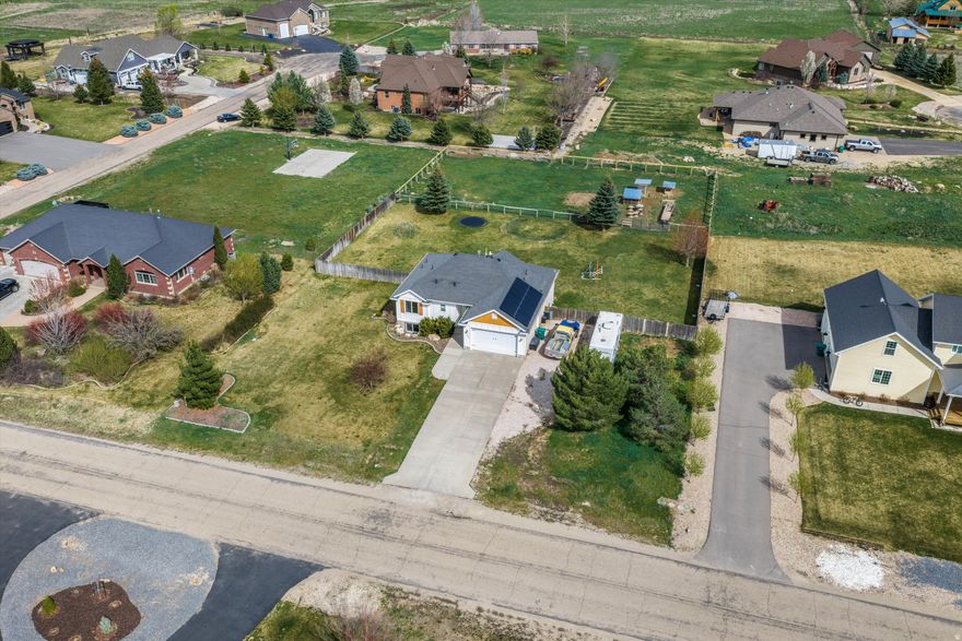 Set on nearly a full acre in the centrally located Eden Acres community, this 4-bedroom, 3-bath home offers space, flexibility, and a rare connection to the heart of Eden. The .92-acre lot is west-facing, creating the perfect backdrop for cool evenings outdoors, whether you are enjoying the expansive lawn or utilizing the back pasture for chickens, goats, or even a horse. Inside, the home features a functional layout with a finished basement that includes a built-in salon that is wired to be a kitchen, if conversion is desired. Offering versatility for future use. Solar panels provide significant long-term energy savings, adding efficiency to everyday living and are paid off. With walkability to downtown Eden, access to bike paths leading to local schools, and room to live the Ogden Valley lifestyle, this property offers a unique blend of convenience and usability that is hard to find in the area. Square footage figures are provided as a courtesy estimate only. Buyer is advised to obtain an independent measurement.