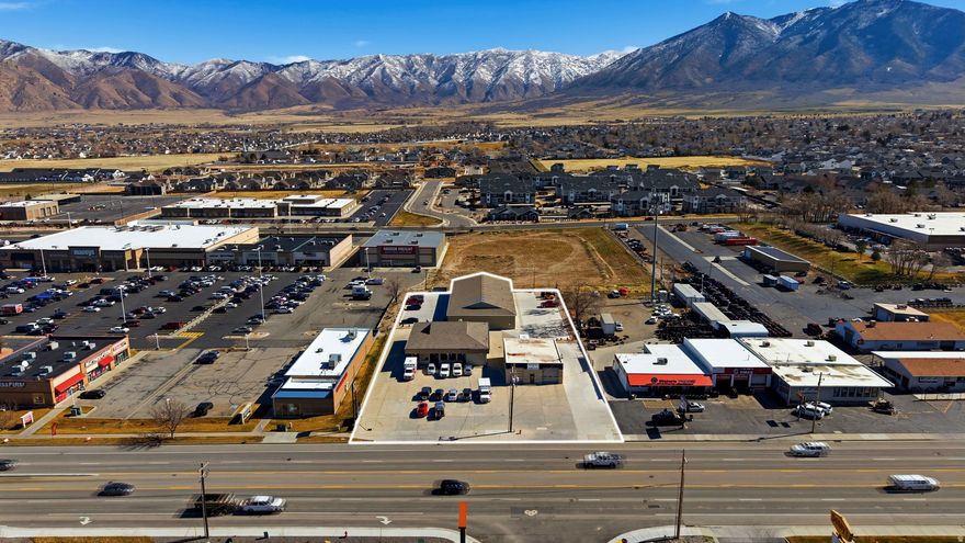 Well-located commercial retail/office property positioned just off Main Street in Tooele, surrounded by established retail and service businesses. The property benefits from strong nearby anchors including Macy's grocery and Walmart, with additional grocers, restaurants, and retail within walking distance.  The property features extensive concrete flatwork across the site, contributing to durability and ease of maintenance for long-term ownership. The building is currently occupied by an established tenant mix with a history of consistent occupancy and documented payment performance. One tenant, a regional ambulance service, has maintained a long-standing presence at the property.  Existing leases include scheduled rent escalations, and no tenant leases are scheduled to expire within the next 12 months, offering income continuity for investors.  Ownership has maintained the property carefully and is willing to assist with buyer due diligence. Lease summaries, financial information, and additional property details are available upon request.  This property presents an opportunity to acquire a stabilized commercial asset in an active Tooele retail corridor with strong surrounding businesses and convenient access to local services and transportation routes. Prospective buyers are encouraged to conduct their own independent verification of all financial and property information.