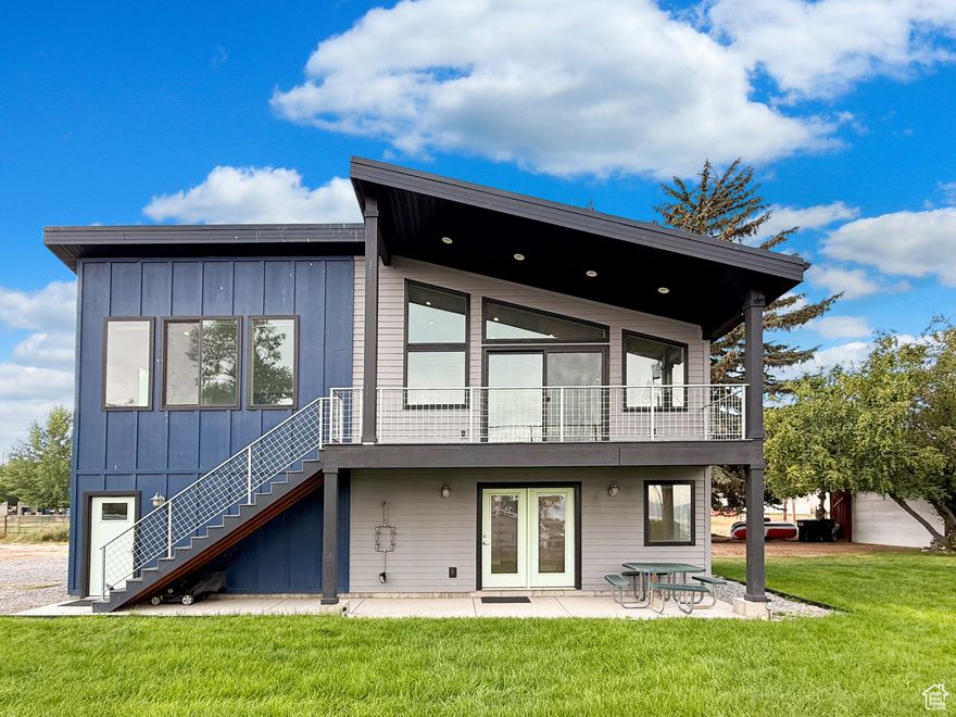 This is the Bear Lake getaway that you have been waiting for!  This newer home is in town giving you great opportunities for dining and recreation.   On top of that the home is located down a quiet lane and gives you water views.  You will love sitting on the covered deck or the patio and soaking up all that the area has to offer!   The home is being sold furnished and will be turn key ready.  It is not part of an HOA so you have rental income potential.    The main level bedroom has built in bunk beds and a built in Murphy bed as well.   There is a great loft bonus or storage space that is 8 x 12.   You will love the outside shower with hot and cold running water.   The sale will also include a push mower, yard tools, the metal picnic table and the two metal shelving units in the garage.    There are also lake toys, kids kayak, the blow up boat and beach wagon.   This is a great house that is just waiting for new owners to make their own memories.