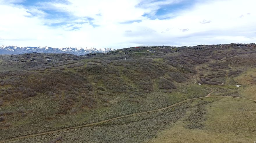 Build your dream home or cabin on this exceptional 1-acre lot in Rockport Estates, featuring a gently sloped hillside with stunning views overlooking the backside of Promontory. Enjoy southern sun exposure, privacy, and year-round access. Power is available in the road and water is already connected, making this an ideal and convenient homesite.  Rockport Reservoir is adjacent to the subdivision, offering easy access to boating, fishing, and outdoor recreation. Located just 15 minutes from Kimball Junction, Park City skiing, shopping, and dining, and only 60 minutes from Salt Lake International Airport, this property offers the perfect balance of serenity and accessibility--ideal for a vacation retreat or full-time residence.  All information deemed reliable; buyer to verify all information to their own satisfaction. Acreage per public record.