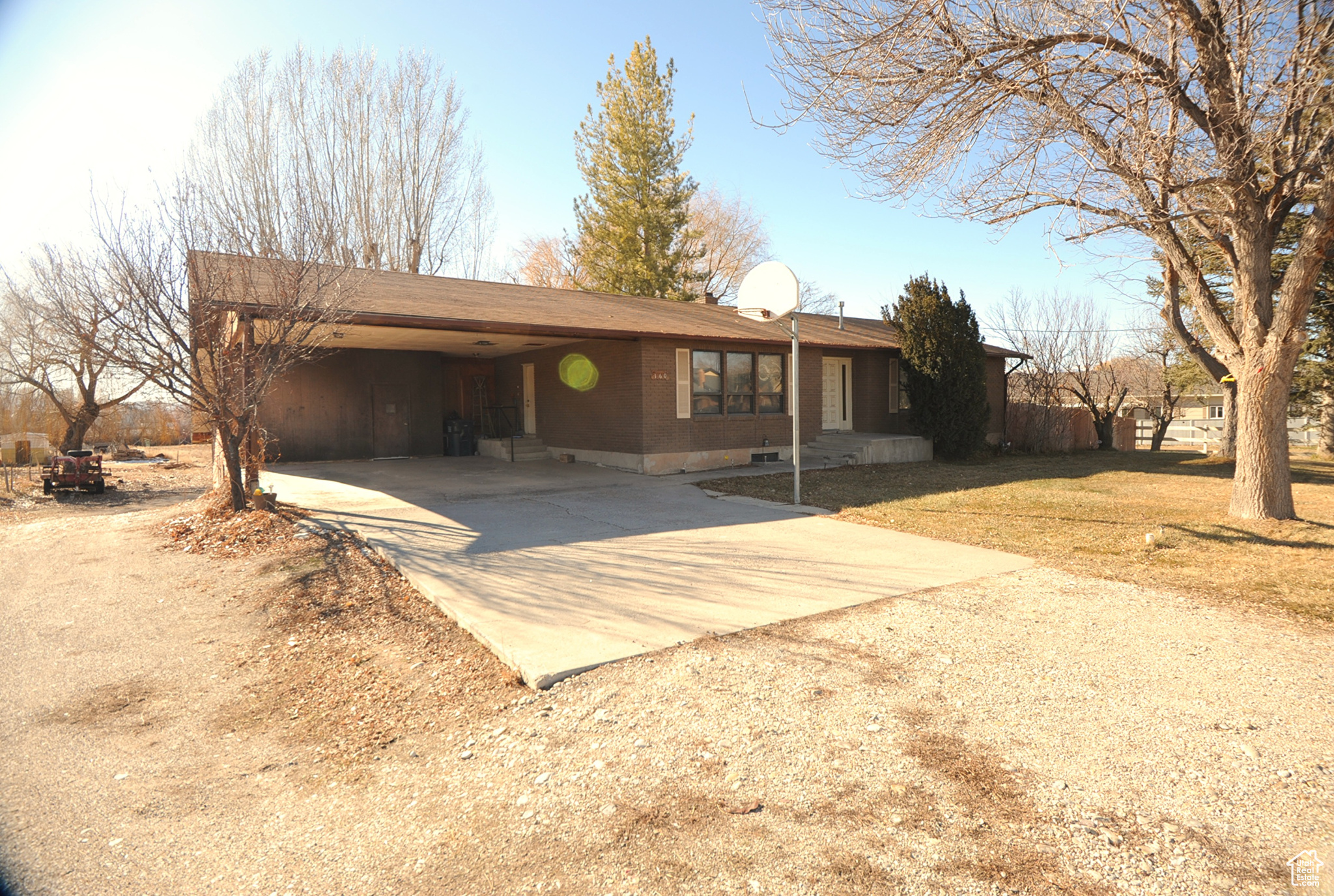 Nice all brick home on large 2 acre lot with horse property. 5 bedrooms and 3.5 baths. Family room has a wood stove in the basement and 2 gas wall unites plus ceiling electric heat. storage room in the back of the carport. 26-8 solid cement storage shed in back. Home needs some work but could nice family home. It has 2 parcels 2205x1 and 2202x2. Fruit trees in mature yard. It has field hookup on irrigation water. Come see this home!