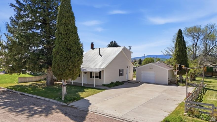 Boy oh boy, you do NOT want to miss this one!  Welcome to this absolutely adorable and beautifully updated 2 bedroom, 1 bathroom home located in the peaceful town of Soda Springs, Idaho. With nearly 1,500 square feet of living space and sitting on almost half an acre, this property offers the perfect mix of comfort, functionality, charm, and outdoor living.  From the moment you pull up, you'll notice how well this home has been cared for and remodeled to create such a warm and inviting feel for you and your family. Inside, you'll find cozy living spaces, updated finishes, and a layout that feels both spacious and welcoming. Whether you're looking for your first home, downsizing, or simply wanting a quiet place to settle down, this property checks so many boxes.  Outside is where this property really shines. The fully fenced yard gives you privacy and plenty of room for kids, pets, entertaining, or simply enjoying the quiet surroundings. There is a single-car garage with additional workshop space, perfect for projects, storage, or hobbies. You'll also find multiple outbuildings, chicken coops, garden boxes, and even a greenhouse with solar already set up for those who love gardening, homesteading, or living a little more self-sustainably.  The playhouse in the backyard stays with the home and creates the perfect little getaway spot for the kids. There is still plenty of open yard space left for gatherings, barbecues, RV parking, trailers, or additional outdoor projects.  Located in a peaceful and quiet neighborhood, this home is conveniently close to schools, gas stations, restaurants, grocery stores, hiking trails, outdoor recreation, and local jobs. Soda Springs is known for its beautiful scenery, friendly small-town feel, and endless outdoor opportunities. If you're looking for a property where you can slow down a little and truly enjoy where you live, this may be the perfect fit for you.  Homes with this much character, land, functionality, and charm do not come around often, especially at this price point.  Come take a look before it's gone!