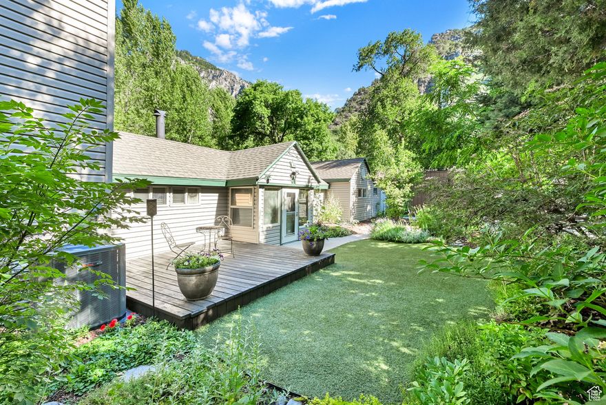 Nestled in the heart of Ogden Canyon this beautiful home sits next to the Ogden River with your own private access to amazing fly fishing and stunning mountain views.  Located on a  secluded and serene lot in Wildwood Estates the home is  surrounded by large trees and majestic mountains.  This charming home has 3 bedrooms, 2 bathrooms, a remodeled kitchen and an amazing deck overlooking the river.  An addition in 2004 expanded the home to include a spacious family room with a fireplace and a large bar with granite countertop and seating  Above is a primary suite with a beautiful rock fireplace and a private deck where you can enjoy the stunning views and the soothing sounds of the river.  The kitchen is updated with newer cabinets, granite countertops, tile floor and stainless appliances. The dining area is intimate and inviting with tile floors and windows looking out to the front garden. A charming cozy den features a Lopi woodburining stove and is surrounded by windows overlooking the river.  The main level is completed with two bedrooms and an updated full bathroom.  Located minutes from world class skiing, boating, hunting, biking and hiking.