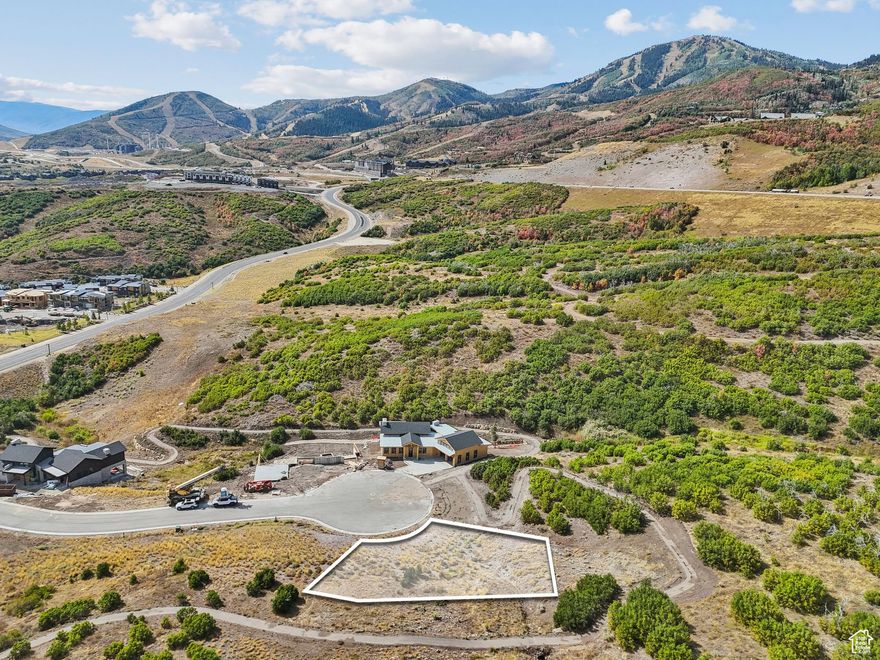 Nestled within the esteemed Capricorn Subdivision of the SkyRidge Mountain Community, this remarkable 0.19-acre lot offers an exceptional opportunity to build your dream home in one of Park City's most coveted destinations. Boasting breathtaking, unobstructed views of both Deer Valley Resort's world-class ski runs and the serene waters of Jordanelle Reservoir, this homesite captures the best of Utah's year-round mountain lifestyle.  As part of the exclusive SkyRidge community, residents enjoy an array of thoughtfully designed amenities, including a 9-hole golf course, a state-of-the-art clubhouse and pool for home owners, a fully stocked pro shop, and a gourmet restaurant and bar. For horse lovers, the on-property equestrian center provides a chance to experience life in the West with premier facilities and direct trail access. Outdoor enthusiasts will also love the easy access to boating, paddleboarding, hiking, and biking, while winter brings unparalleled skiing just minutes away at Deer Valley's new East Village.  Whether you're envisioning a full-time residence, a mountain getaway, or a legacy home to be enjoyed for generations, this homesite provides the perfect backdrop. Experience the ideal blend of adventure, relaxation, and luxury at SkyRidge-your basecamp for everything Park City has to offer.