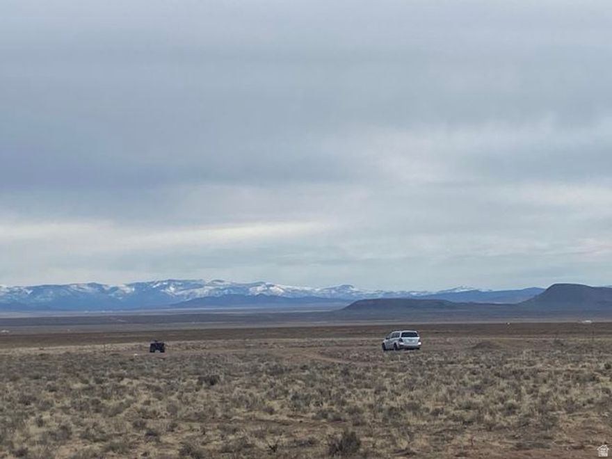 This might be the best piece of land in the Beryl/Lund area! Flat, grassy land with 1 Acre Foot of water (1945 Priority Date, #71-5760) and access via a deeded easement from the BLM. A dirt road has been cut in, making access with vehicles or a trailer very easy! Surrounded on 3 sides by either BLM or state land with 360 degree views! It is part of the SouthWest Desert Trophy Elk Unit. The property has a fence running down the west boundary and rough boundary corners are staked. Soils analysis provided in document section.