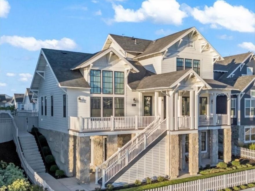 Magnificent lakefront masterpiece on Daybreak Island captures spectacular lake and mountain views. Wow! Gorgeous designer furniture and decor included in sale. Exciting opportunity to move right in and celebrate the holidays! Stunning great room features  Italian tile fireplace and exposed beams. Exquisite gourmet kitchen is a culinary showcase. Viking appliances, premium quartz surfaces, and paneled wall butler's pantry. Luxurious main-level primary suite is a serene sanctuary with mesmerizing lake views, spa-inspired bath and custom walk-in closet. Three additional en-suites include private baths.  Incredible walk-out lower level is perfect for lavish entertaining and ready to add full second kitchen and home theater.  Fabulous, outdoor living spaces embrace lakefront living and hosting gatherings.  Impressive, heated three car garage with epoxy flooring. The Island at Daybreak offers a luxury lifestyle. Pavilions, sandy beaches, firepits, and paved walkway around the lake. Residents enjoy complimentary kayaks, canoes and paddle boards. Minutes to Downtown Daybreak restaurants, concerts, new megaplex entertainment complex and Salt Lake Bees stadium.  Truly an extraordinary residence on Daybreak Island. 11064PaddleBoardWay.com