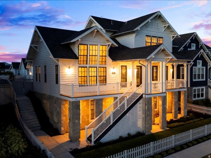 Magnificent lakefront masterpiece on Daybreak Island captures spectacular lake and mountain views. Wow! Gorgeous designer furniture and decor included in sale. Exciting opportunity to move right in and celebrate the holidays! Stunning great room features  Italian tile fireplace and exposed beams. Exquisite gourmet kitchen is a culinary showcase. Viking appliances, premium quartz surfaces, and paneled wall butler's pantry. Luxurious main-level primary suite is a serene sanctuary with mesmerizing lake views, spa-inspired bath and custom walk-in closet. Three additional en-suites include private baths.  Incredible walk-out lower level is perfect for lavish entertaining and ready to add full second kitchen and home theater.  Fabulous, outdoor living spaces embrace lakefront living and hosting gatherings.  Impressive, heated three car garage with epoxy flooring. The Island at Daybreak offers a luxury lifestyle. Pavilions, sandy beaches, firepits, and paved walkway around the lake. Residents enjoy complimentary kayaks, canoes and paddle boards. Minutes to Downtown Daybreak restaurants, concerts, new megaplex entertainment complex and Salt Lake Bees stadium.  Truly an extraordinary residence on Daybreak Island. 11064PaddleBoardWay.com