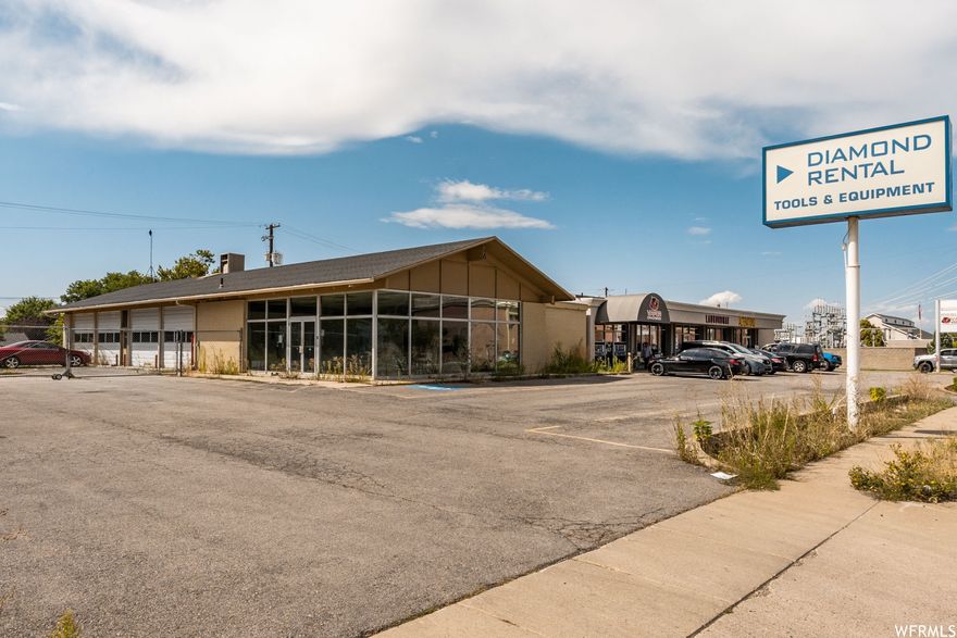 Great Bountiful location, 4 GL doors, 14' ceilings warehouse area. 4- 12'x12' GL doors newer doors. plenty of parking and secured fenced area, front Office windows were recently replaced with lowE windows, Floor drains in warehouse. possible to add another structure on property.