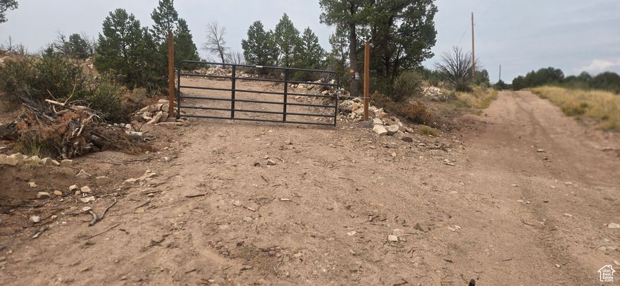 Car port and Storage container will be sold with the property. Miles from the Big G. Accessible for majority of the year. Water Certificate with approval from the state to drill for well. Gated Property on top of Current Creek Mountain. Culverts installed