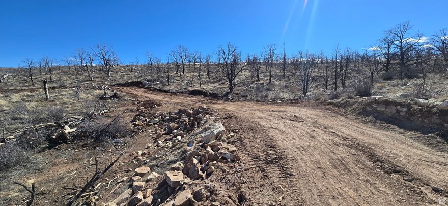 Car port and Storage container will be sold with the property. Miles from the Big G. Accessible for majority of the year. Water Certificate with approval from the state to drill for well. Gated Property on top of Current Creek Mountain. Culverts installed