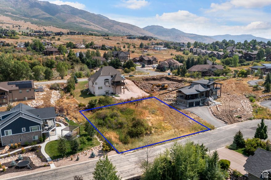 Discover a rare chance to own a prime cul-de-sac lot in the Elkhorn community, just steps from Wolf Creek Golf Course, with no HOA fees. This picturesque .37-acre homesite offers sweeping mountain views, a peaceful atmosphere, and in spring, the soothing sound of a stream that gently meanders along the edge of the property. The lot's gradual slope provides flexibility for a variety of building plans, making it the perfect setting for your dream mountain residence. Here, outdoor living is at your doorstep, minutes from boating and fishing at Pineview Reservoir, endless hiking and biking trails, and world-class skiing at Powder Mountain Snowbasin, and Nordic Valley. Utilities are conveniently available: water, sewer, and irrigation are stubbed to the lot. Elevate your lifestyle and embrace all that Ogden Valley living has to offer. Boundary lines are provided as a courtesy estimate only. Buyer is advised to obtain an independent measurement.