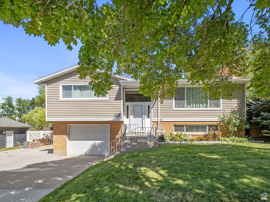 Don't miss this West Valley gem! Pride of ownership shines from top to bottom, starting with the curb appeal and continuing through the quality finishes inside and the backyard oasis. The layout features a spacious front room that flows into the dining area and a beautifully updated kitchen. Step out onto the deck and enjoy a view of one of the largest backyards you'll find in your search.  Complete with RV parking. The basement offers a cozy family room, a third bedroom, and its own bathroom.  Perfect for guests or extra living space.  Newly updated bathroom will a marble finish, Stainless steel appliances and two fireplaces give it a nice finish.