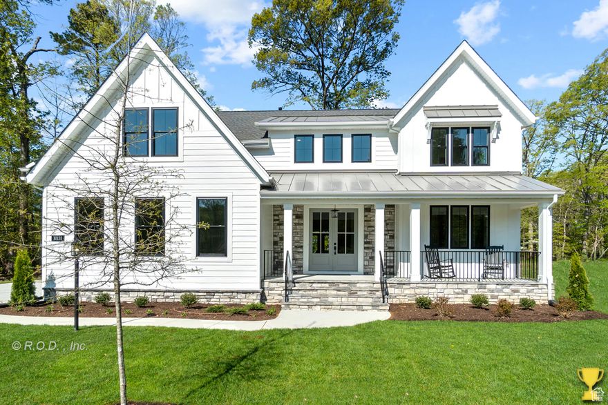 Welcome to your dream home in the heart of Mapleton-where thoughtful design meets timeless craftsmanship. 3D rendering link http://bit.ly/485gOzc This stunning 6-bedroom, 4.5-bathroom custom residence offers over 5,400 square feet of beautifully finished space, nestled on a flat 0.34-acre lot  Large windows, 11' living room ceilings, and upgraded lighting throughout the home flood the space with natural light and warmth. The open-concept main level is anchored by a striking floor-to-ceiling stone fireplace and features white and navy cabinetry, brass hardware, and a custom wood hood vent that brings a designer touch to the gourmet kitchen. Entertain with ease around the oversized island, or flow effortlessly to the covered back patio-perfect for evenings enjoying the mountain views. The luxurious primary suite offers a soaking tub, separate shower, and a walk-in closet with a window bench.  Every detail was considered-from wainscoting in the dining area to the built-in lockers in the mudroom for everyday ease. The fully finished basement includes a versatile 2-bed, 1-bath ADU with a full kitchen, private laundry, and separate entrance.  Additional highlights include upgraded lighting, a covered back patio, and an oversized 3-car garage with an extended third bay. Photos are representative and depict a similar home. Renderings and floor plans are for illustrative purposes only and may not reflect the final product. Estimated completion date Feb 2026.